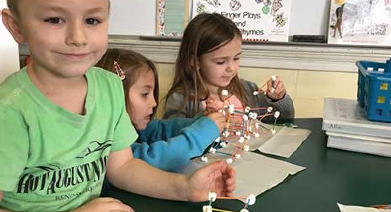 Kindergartners have fun (and a snack!) while learning about shapes