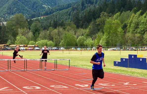 Students running hurdles